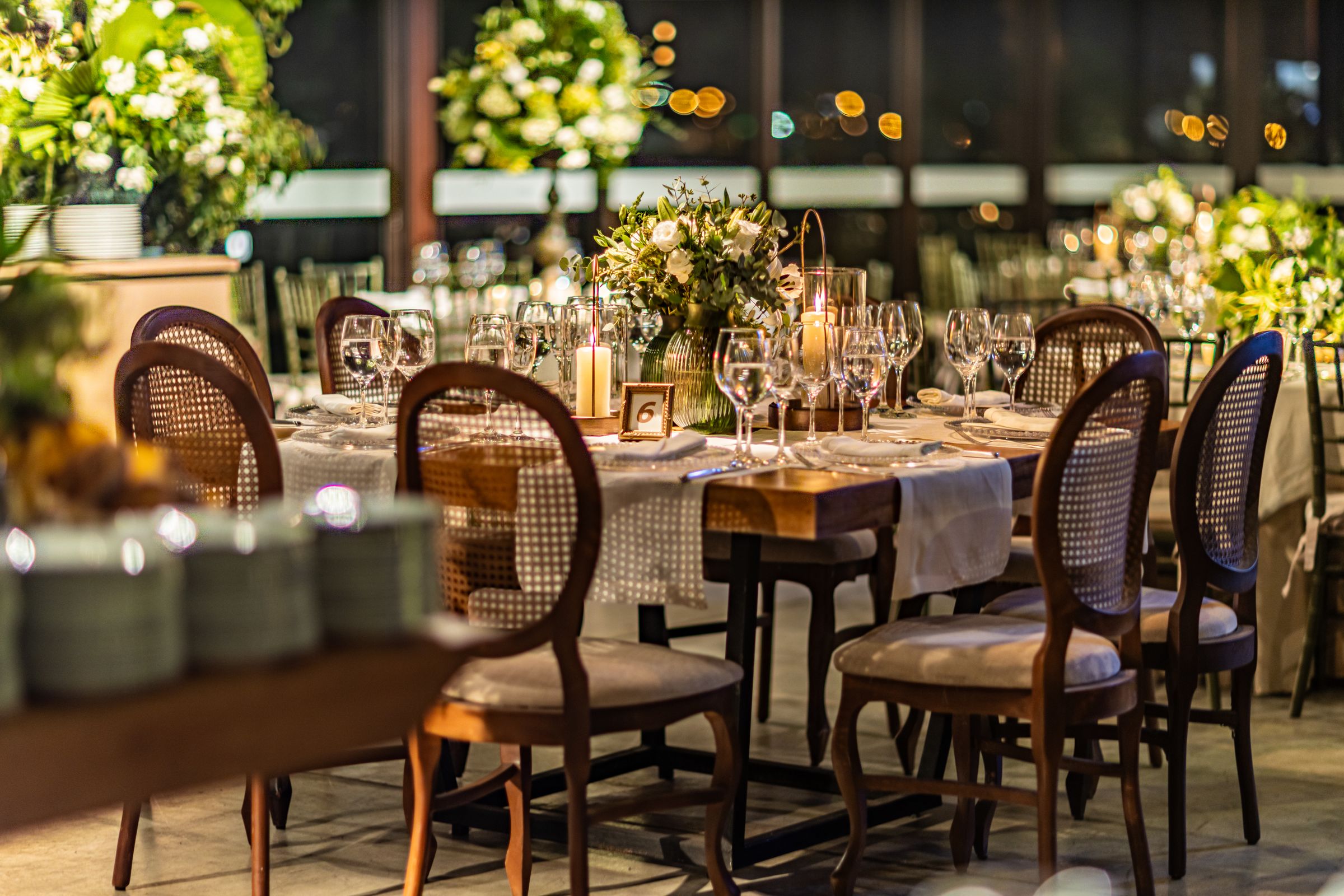 A long table laid with florals and candlelight