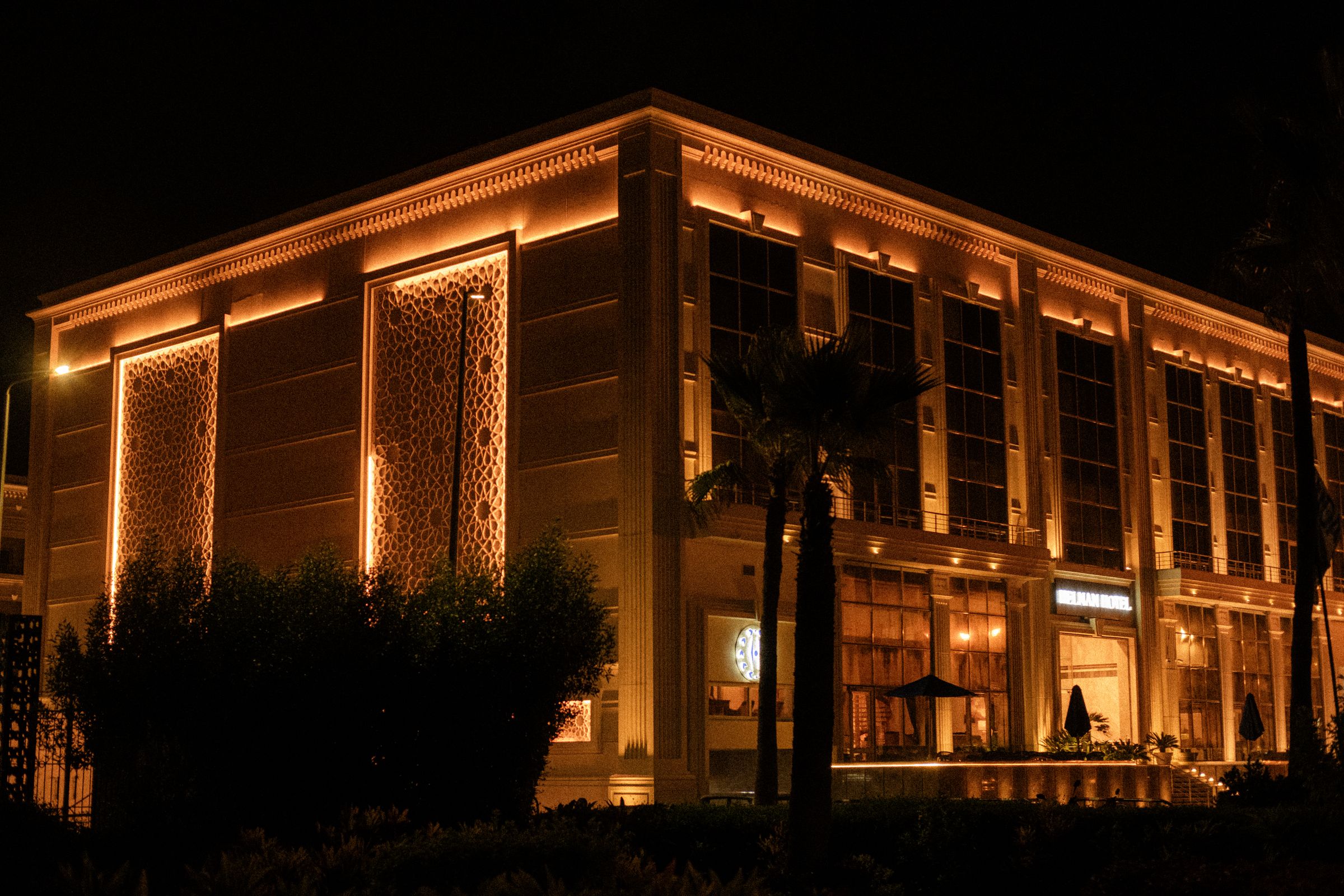 An illuminated hotel facade at night